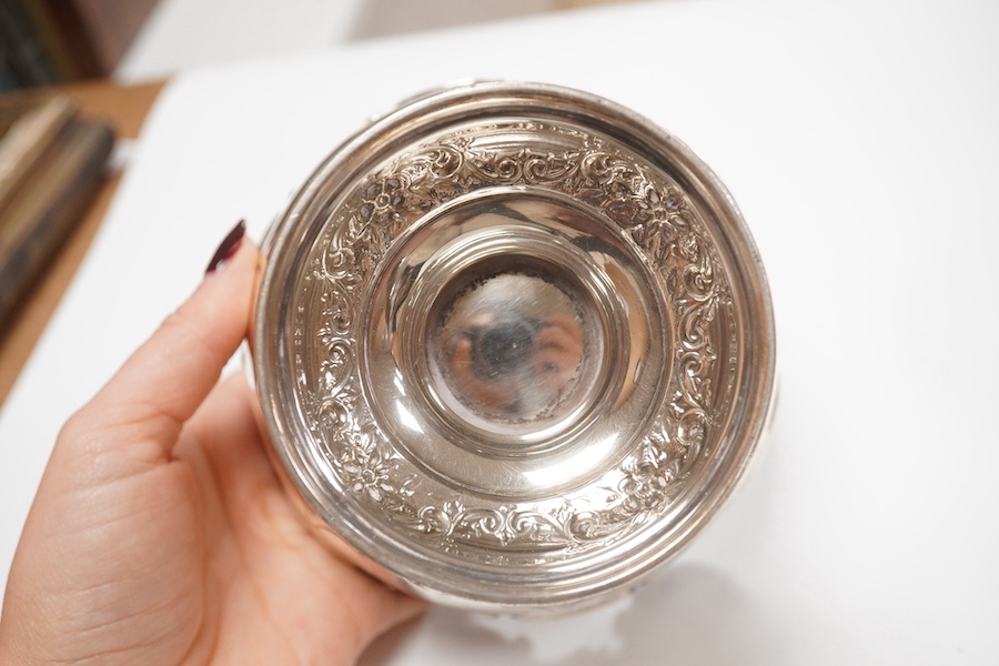 A George III small silver sugar basket, London, 1810, with blue glass liner, 57mm, a George III silver sifter spoon, a pair of silver bonbon dishes and an Edwardian small rose bowl, 16.9oz. Condition - poor to fair to go